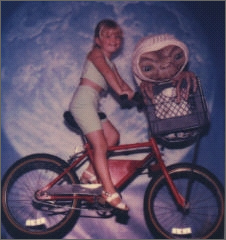 Lauren riding on ET's bike